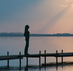 Woman Standing on Dock